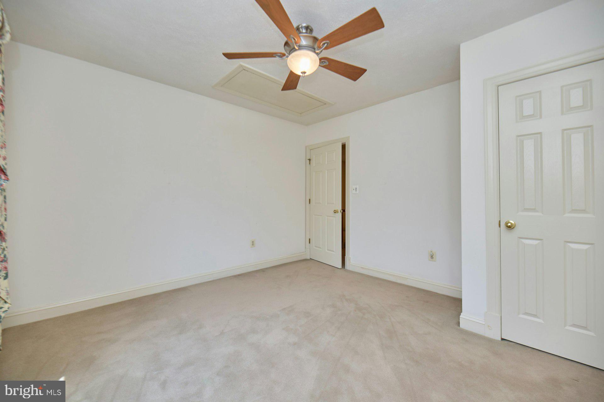 6051 Adams Drive La Plata, MD 20646 - Photo 42 of 72 an empty room with closet and a ceiling fan