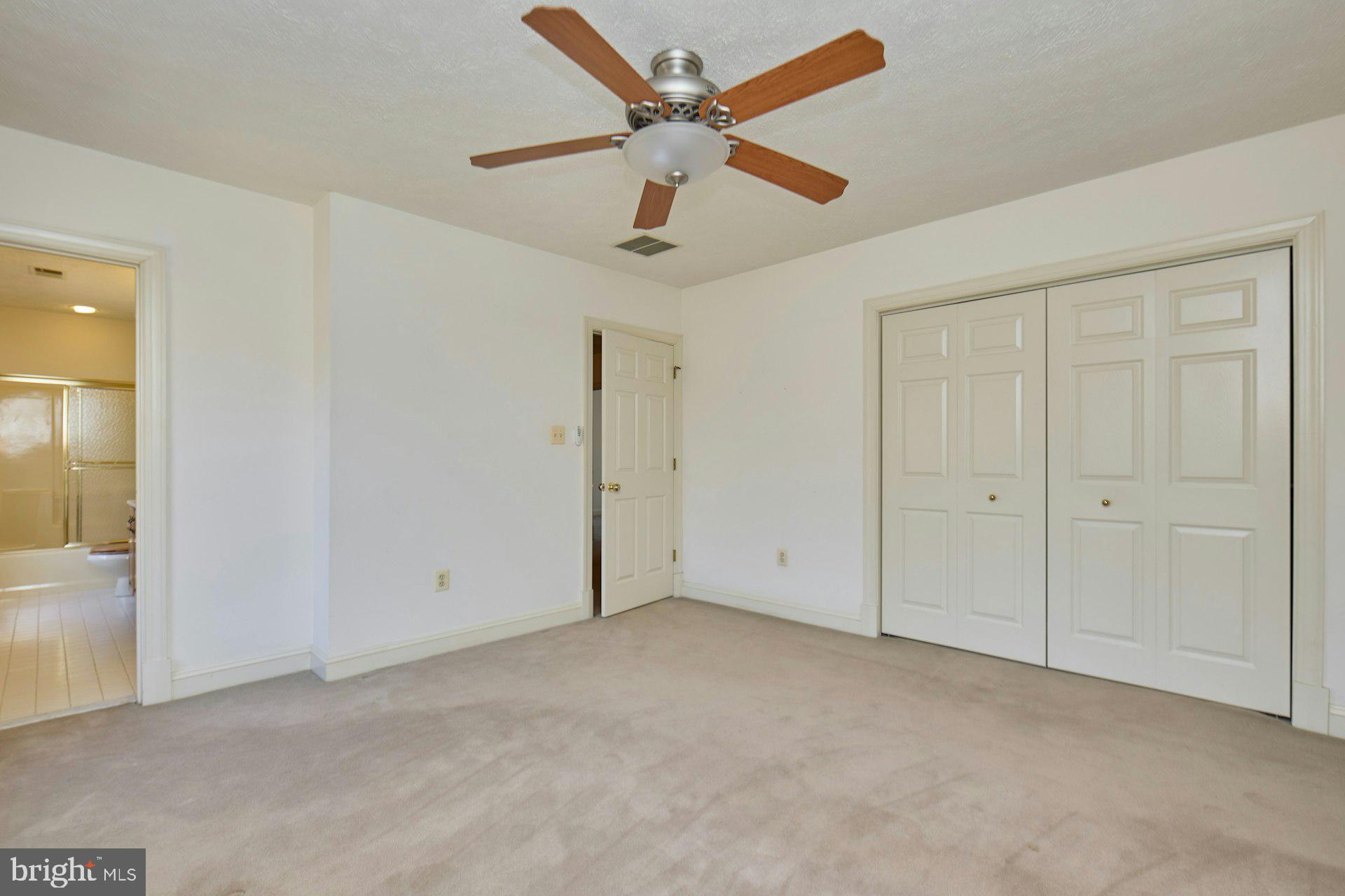 6051 Adams Drive La Plata, MD 20646 - Photo 45 of 72 an empty room with chandelier fan
