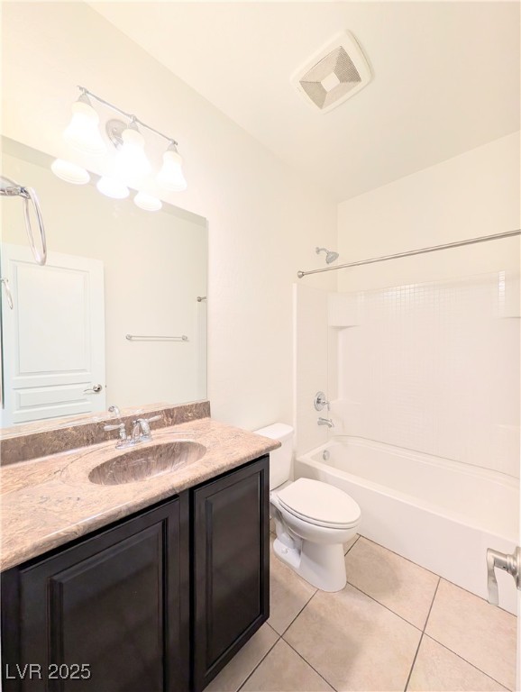 7011 Amapa Road Las Vegas, NV 89178 - Photo 18 of 32 Bathroom featuring light tile patterned flooring, tub / shower combination, and vanity