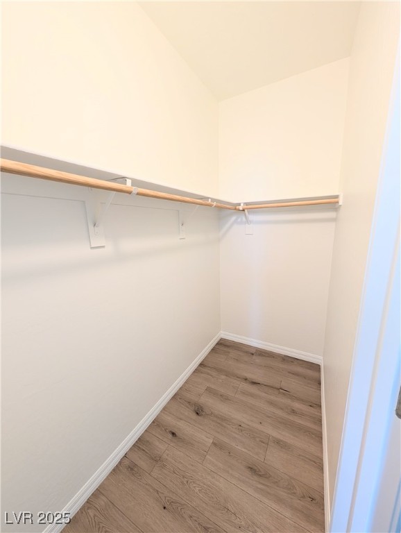 7011 Amapa Road Las Vegas, NV 89178 - Photo 22 of 32 Spacious closet with light wood finished floors