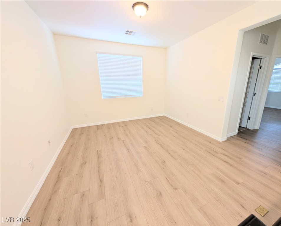 7011 Amapa Road Las Vegas, NV 89178 - Photo 23 of 32 Spare room featuring light wood-style floors