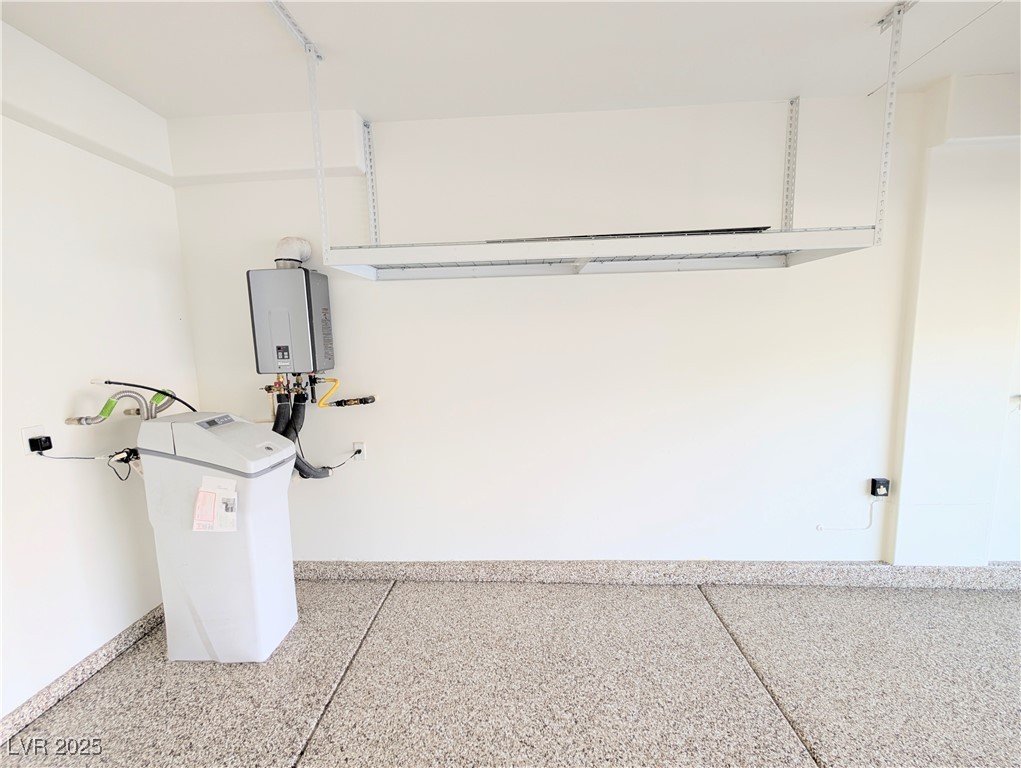7011 Amapa Road Las Vegas, NV 89178 - Photo 29 of 32 Garage with baseboards and tankless water heater