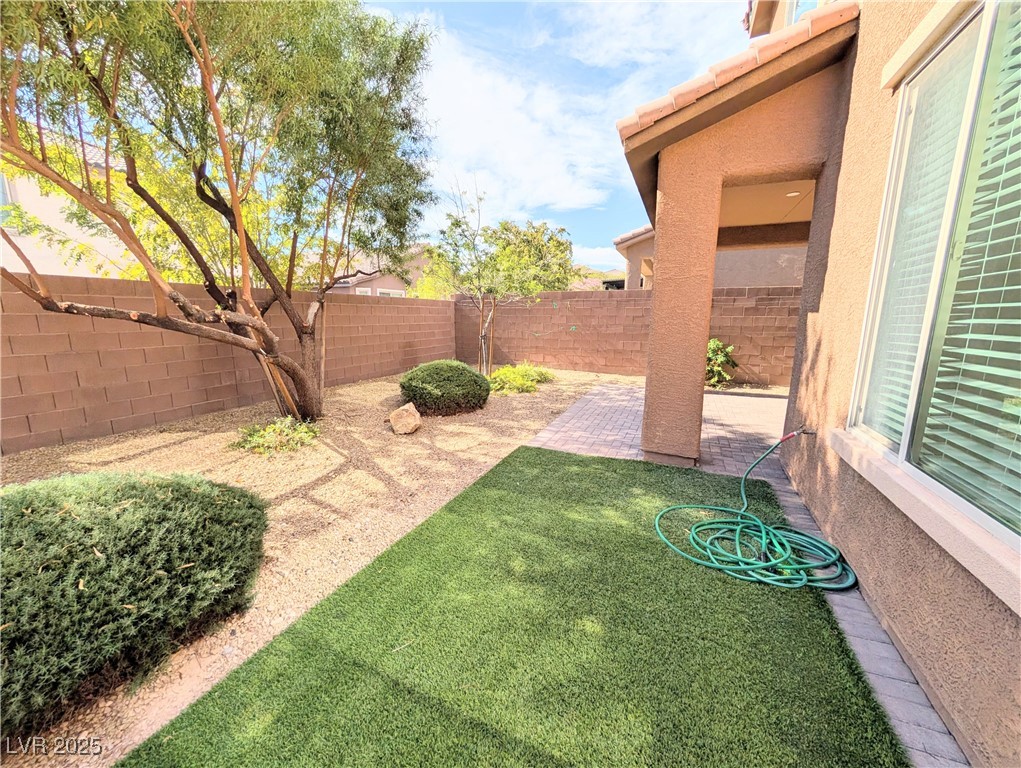 7011 Amapa Road Las Vegas, NV 89178 - Photo 30 of 32 Fenced backyard with a patio