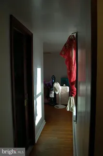 a bedroom with bed and a window
