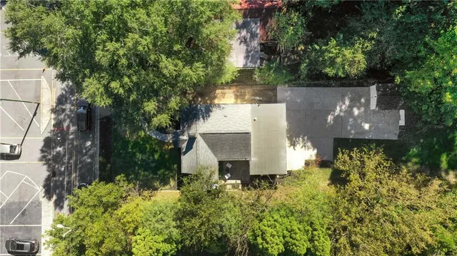 an aerial view of a house with a yard and a garden
