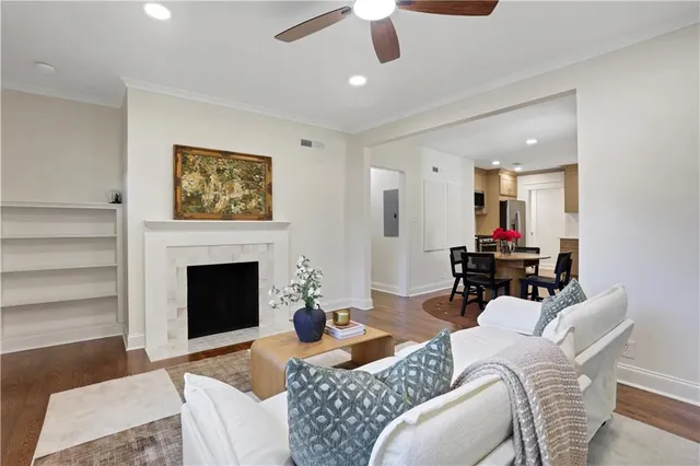 a bedroom with a bed and a potted plant