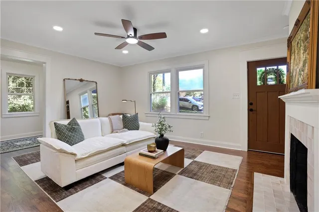 a kitchen with stainless steel appliances a sink a stove a refrigerator and cabinets