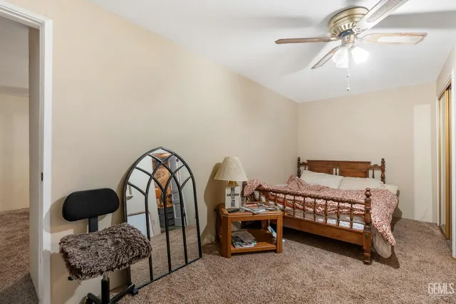 a view of a patio with table and chairs and potted plants