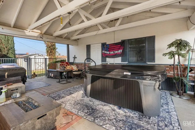 a living room with lots of furniture and kitchen view