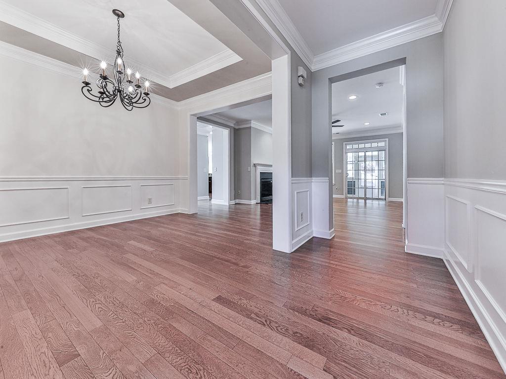 626 Laurel Crossing Canton, GA 30114 - Photo 13 of 77 wooden floor in an empty room with a window