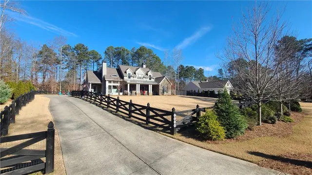 a swimming pool with outdoor seating and yard