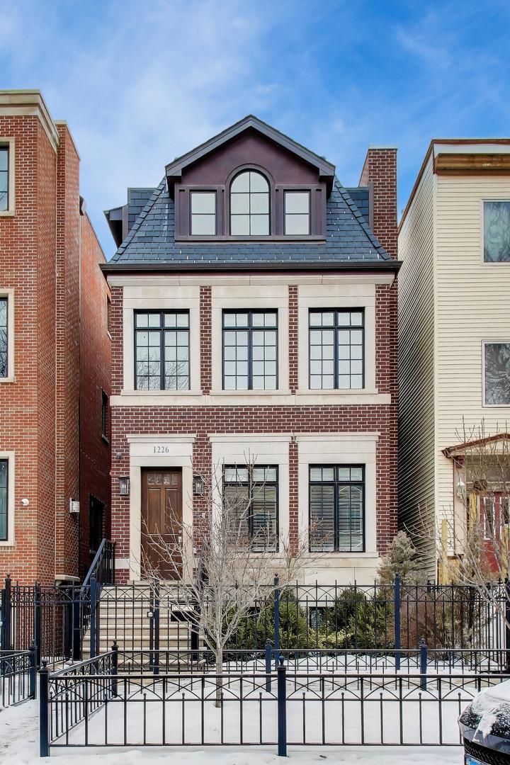 1226 West Henderson Street Chicago, IL 60657 - Photo 1 of 32 a front view of a house with glass windows