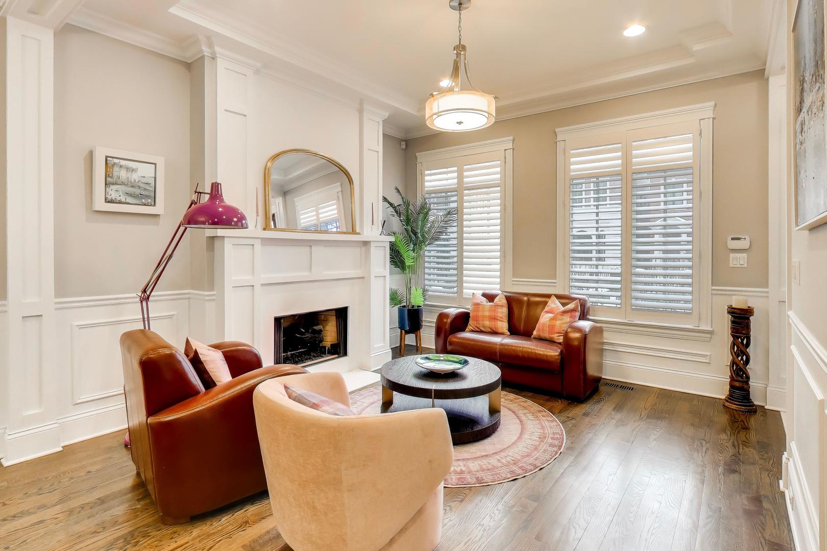 1226 West Henderson Street Chicago, IL 60657 - Photo 3 of 32 a living room with furniture fireplace and a large window