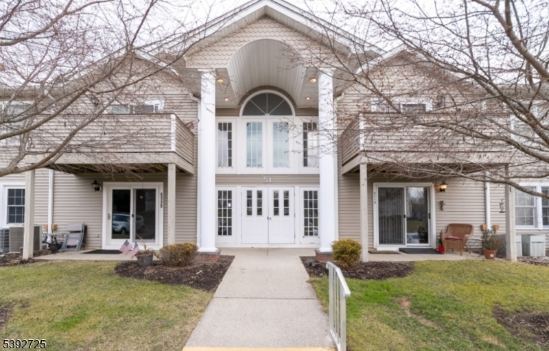 5111 Austin Court, Unit 11 Hackettstown, NJ 07840 - Photo 1 of 19 a view of a brick house with large windows