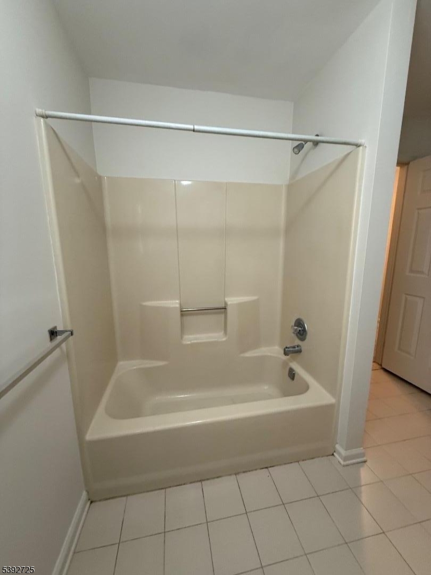 5111 Austin Court, Unit 11 Hackettstown, NJ 07840 - Photo 12 of 19 a white bath tub sitting next to a shower