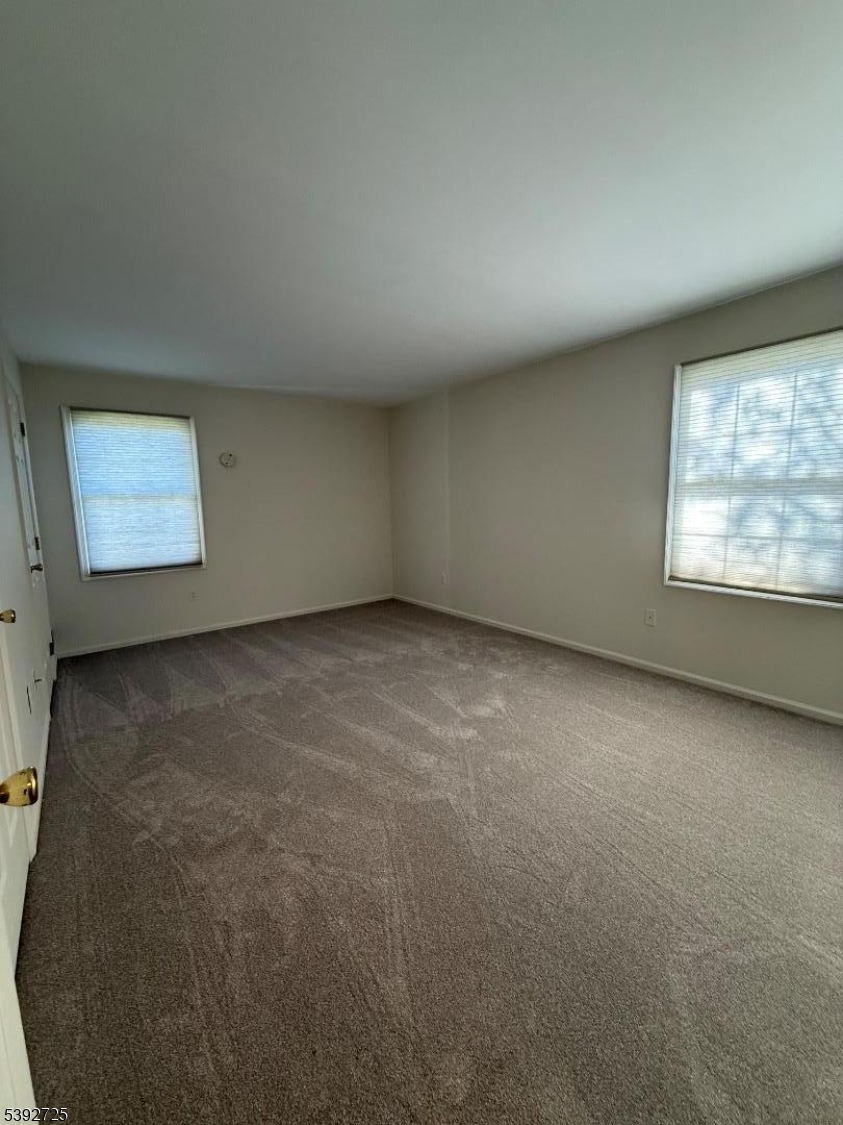 5111 Austin Court, Unit 11 Hackettstown, NJ 07840 - Photo 13 of 19 an empty room with a window