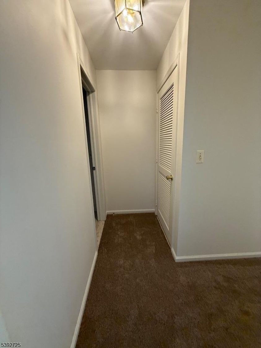 5111 Austin Court, Unit 11 Hackettstown, NJ 07840 - Photo 17 of 19 an empty room with wooden floor and windows