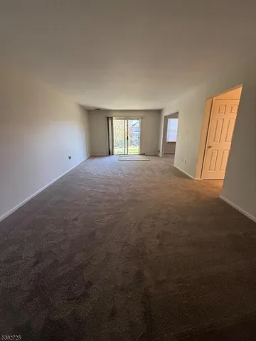 a view of empty room with windows