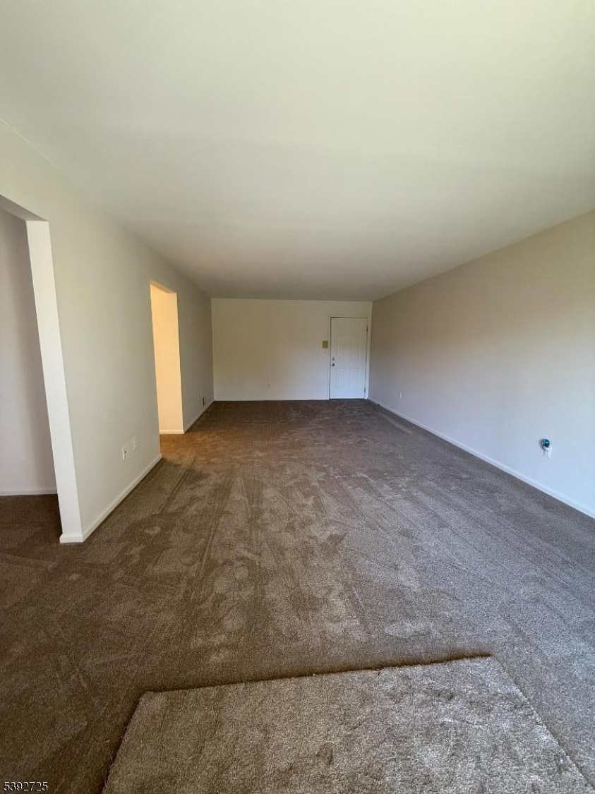 5111 Austin Court, Unit 11 Hackettstown, NJ 07840 - Photo 3 of 19 an empty room with windows