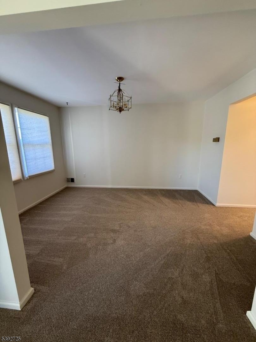 5111 Austin Court, Unit 11 Hackettstown, NJ 07840 - Photo 4 of 19 an empty room with a window