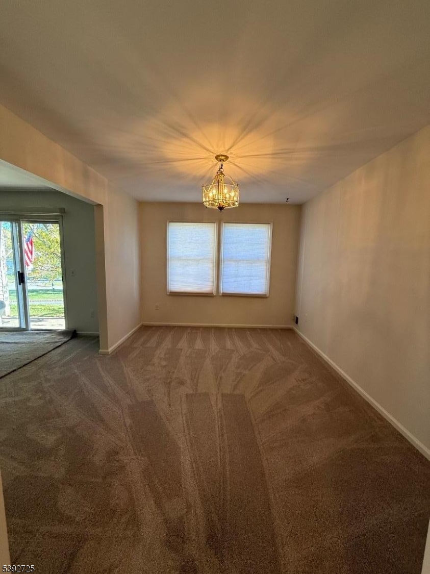 5111 Austin Court, Unit 11 Hackettstown, NJ 07840 - Photo 5 of 19 an empty room with a window