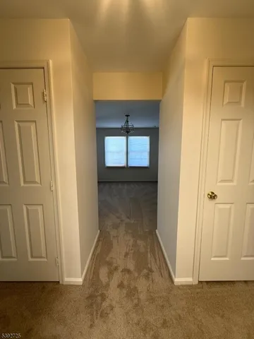 an entryway with wooden floor