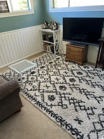 a living room with a couch and a flat screen tv