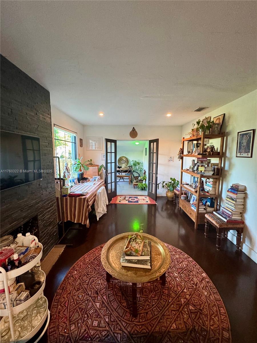 7020 Northeast 5th Avenue Miami, FL 33138 - Photo 11 of 42 a room with furniture and a wooden floor