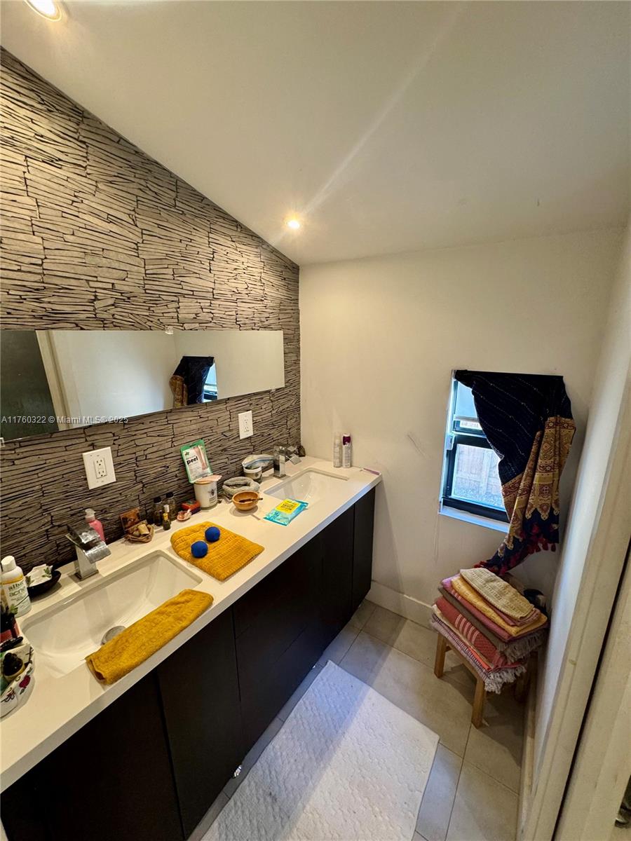 7020 Northeast 5th Avenue Miami, FL 33138 - Photo 14 of 42 a room with furniture pool table and a window