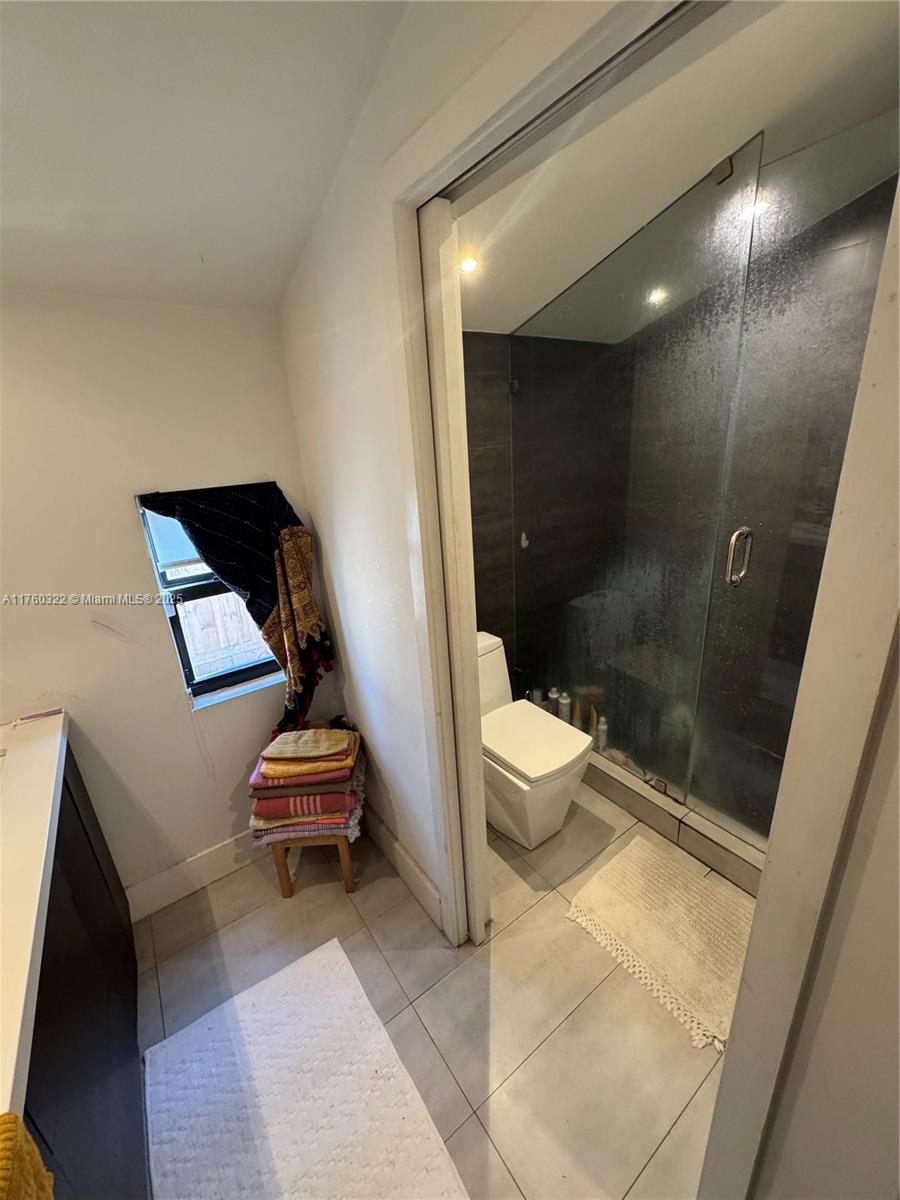 7020 Northeast 5th Avenue Miami, FL 33138 - Photo 16 of 42 a bathroom with a toilet and a shower