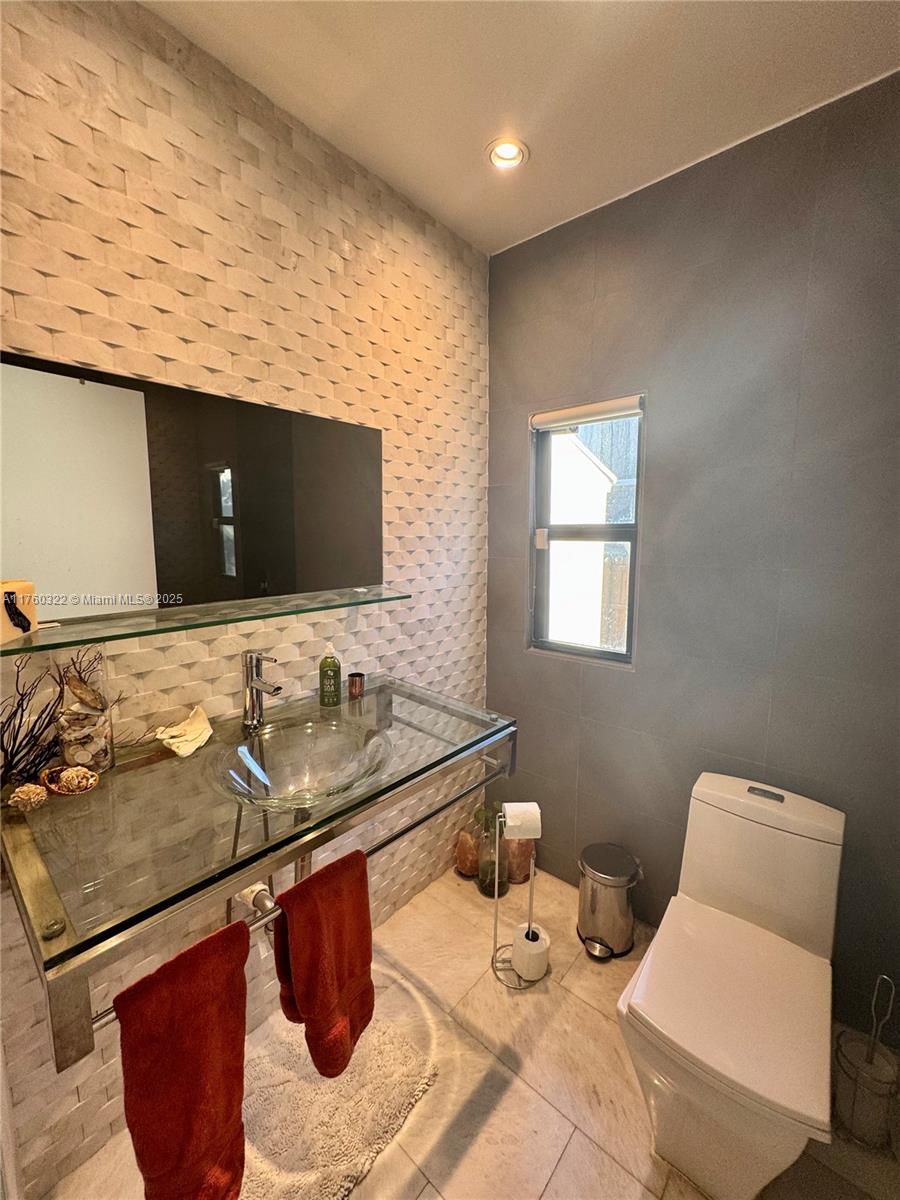 7020 Northeast 5th Avenue Miami, FL 33138 - Photo 20 of 42 a bathroom with a sink and a toilet