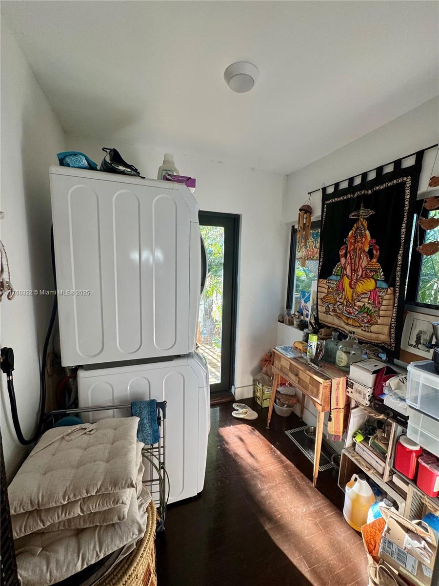 7020 Northeast 5th Avenue Miami, FL 33138 - Photo 22 of 42 a room with furniture and a flat screen tv