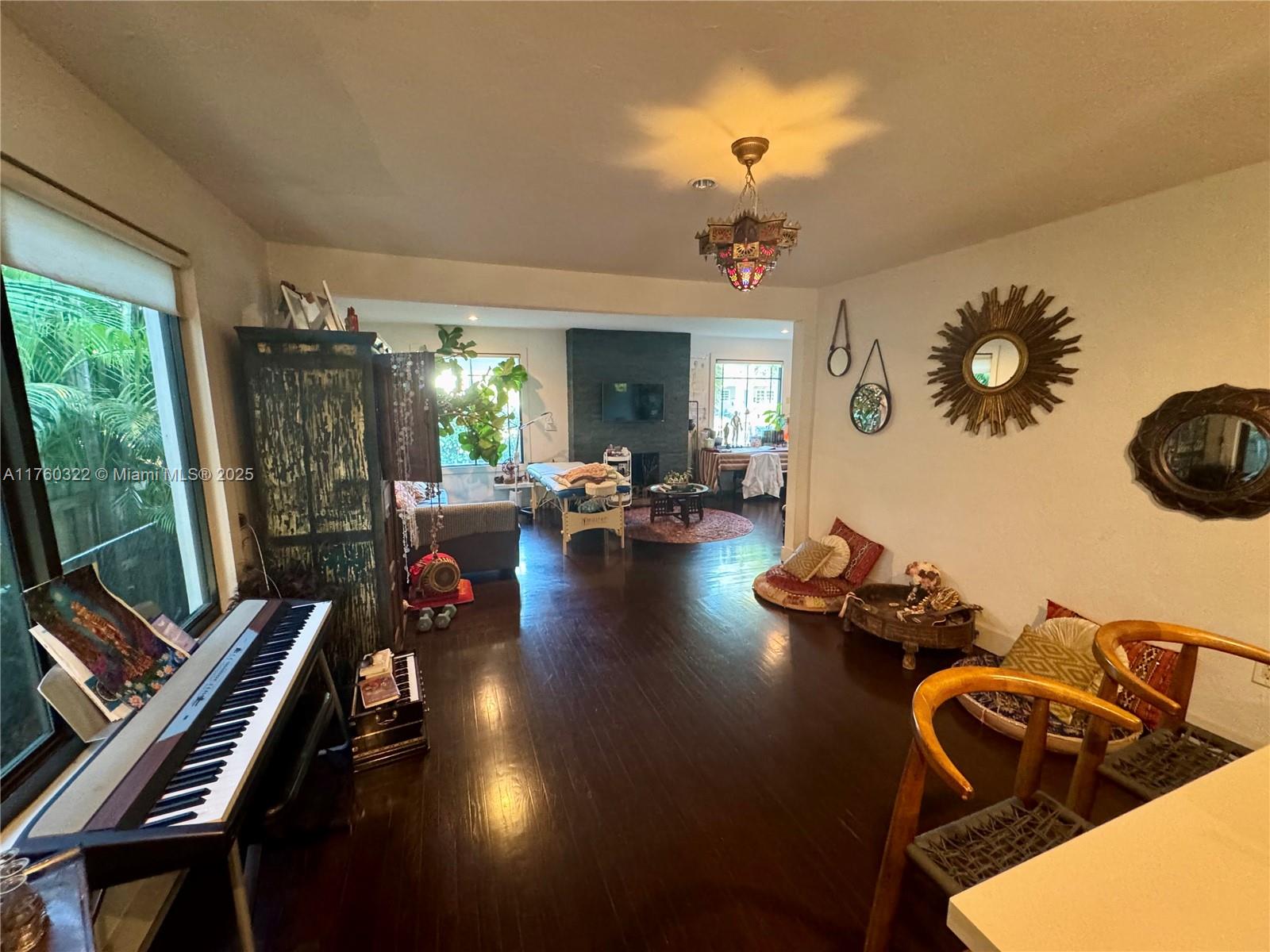 7020 Northeast 5th Avenue Miami, FL 33138 - Photo 4 of 42 a living room with furniture chess table and a large window