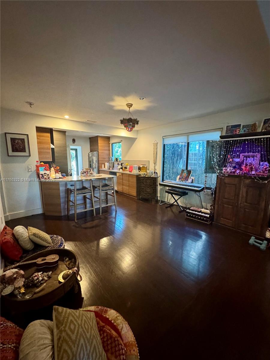 7020 Northeast 5th Avenue Miami, FL 33138 - Photo 5 of 42 a living room with furniture and a wooden floor