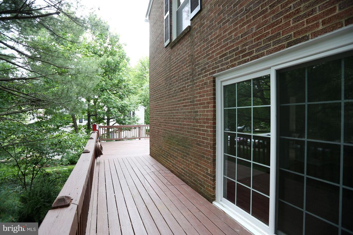 1725 Logmill Lane Gaithersburg, MD 20879 - Photo 17 of 30 a view of balcony with wooden floor and fence