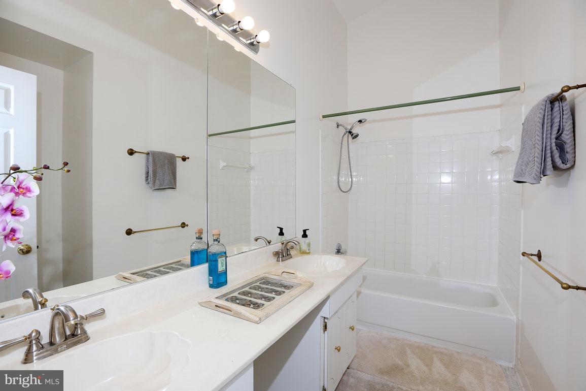 1725 Logmill Lane Gaithersburg, MD 20879 - Photo 20 of 30 a bathroom with a tub sink and shower