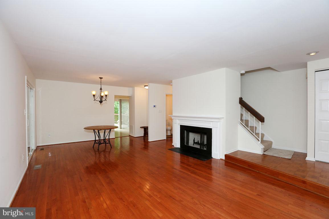 1725 Logmill Lane Gaithersburg, MD 20879 - Photo 4 of 30 a view of a livingroom with furniture and a fireplace
