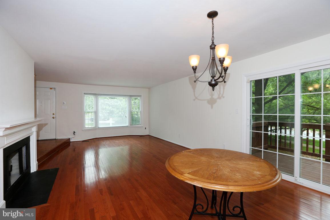 1725 Logmill Lane Gaithersburg, MD 20879 - Photo 6 of 30 a view of a room with wooden floor fan and window