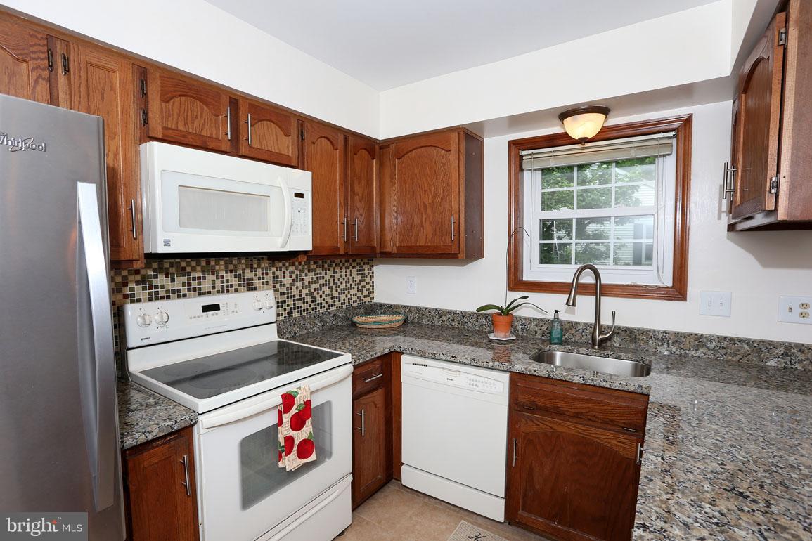 1725 Logmill Lane Gaithersburg, MD 20879 - Photo 10 of 30 a kitchen with sink cabinets and window