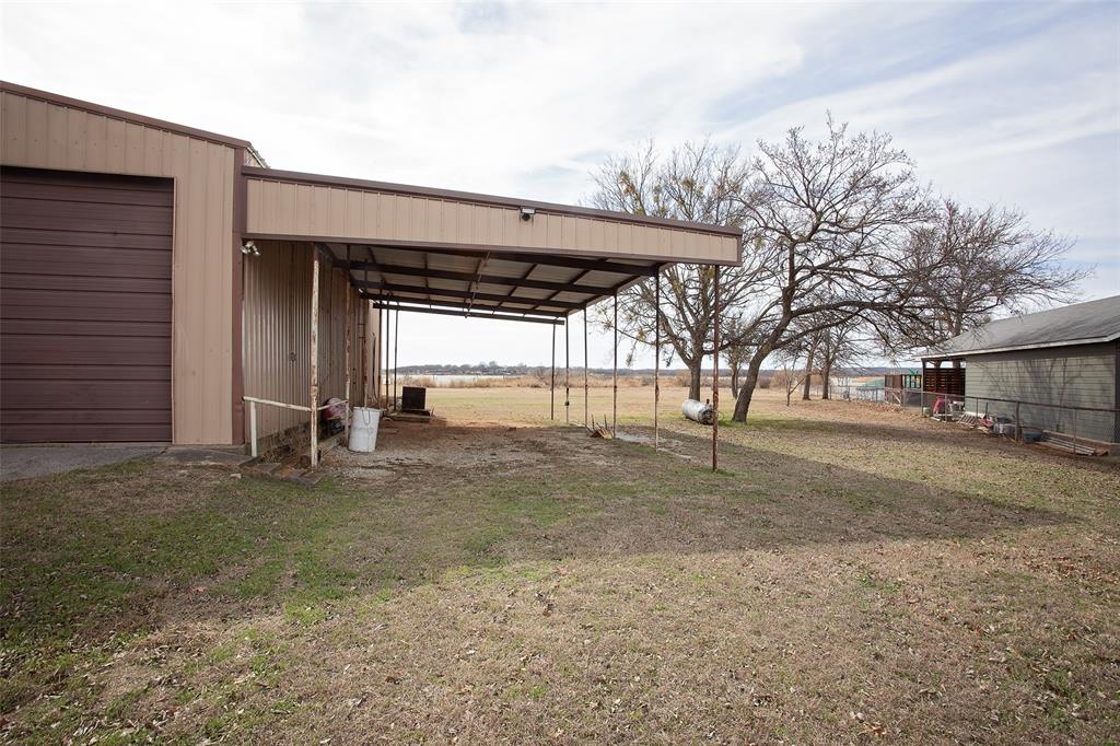 1193 Eastside Lake Road Graham, TX 76450 - Photo 3 of 38 a view of a yard with car parked