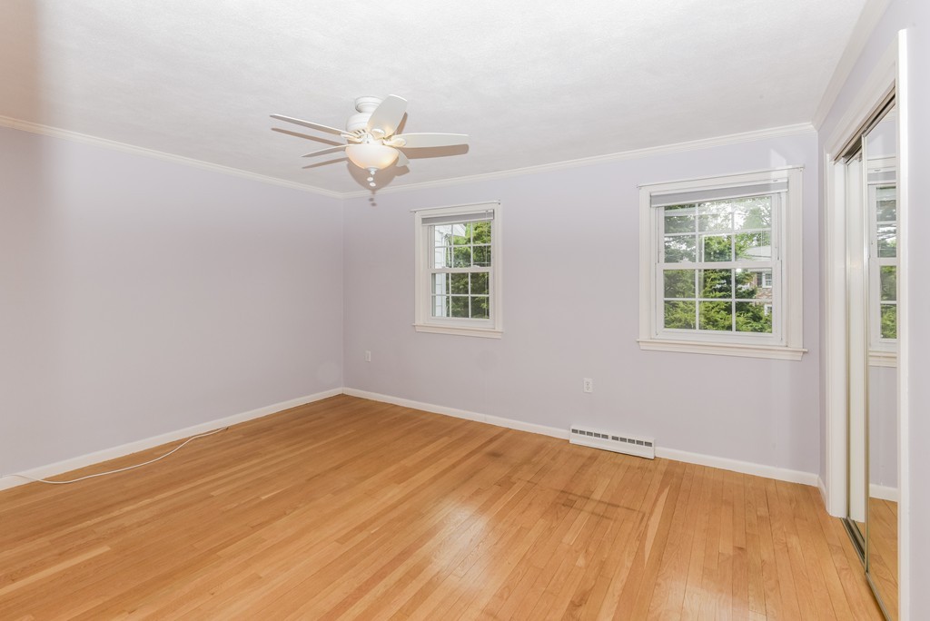 36 Clough Road, Unit 36 Dedham, MA 02026 - Photo 11 of 19 wooden floor in an empty room with a window