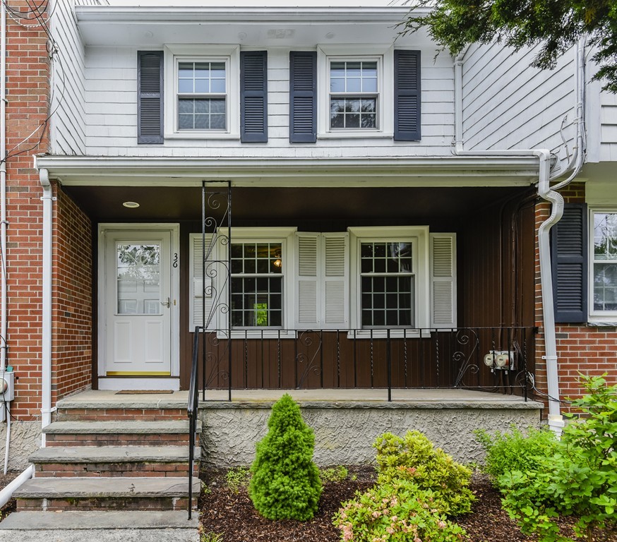 36 Clough Road, Unit 36 Dedham, MA 02026 - Photo 2 of 19 a front view of a house with a yard and outdoor seating