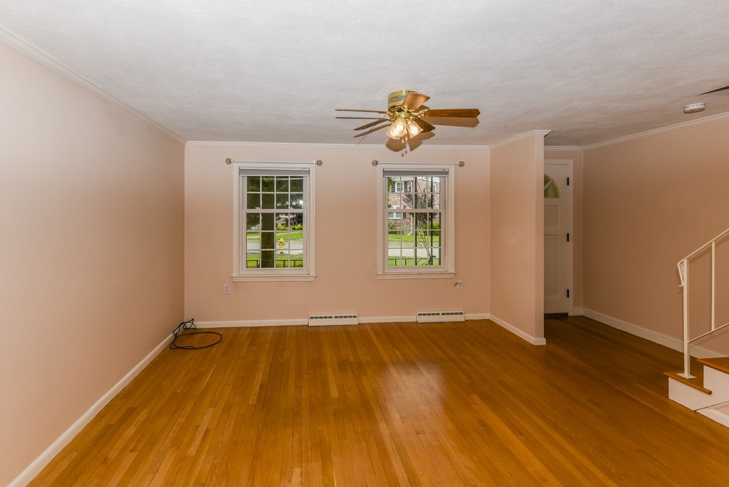 36 Clough Road, Unit 36 Dedham, MA 02026 - Photo 3 of 19 an empty room with windows and wooden floor