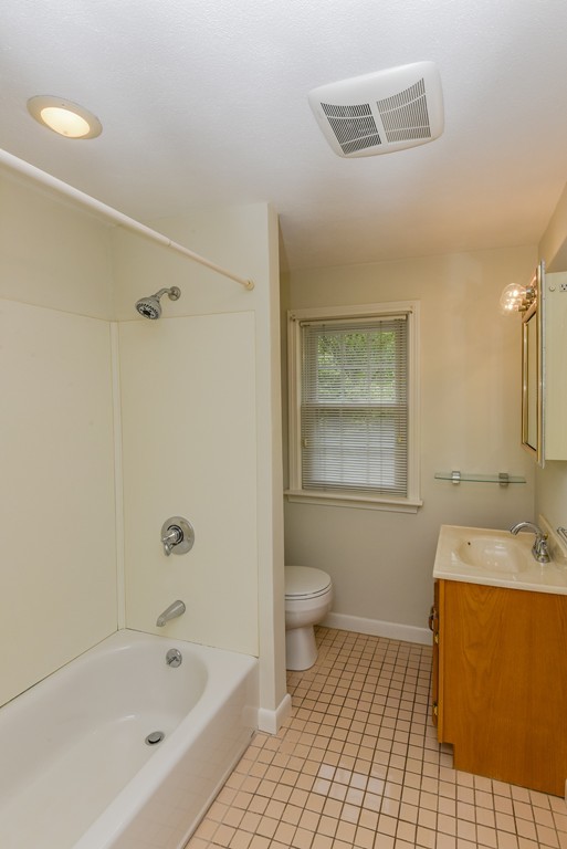 36 Clough Road, Unit 36 Dedham, MA 02026 - Photo 10 of 19 a bathroom with a sink a toilet and shower