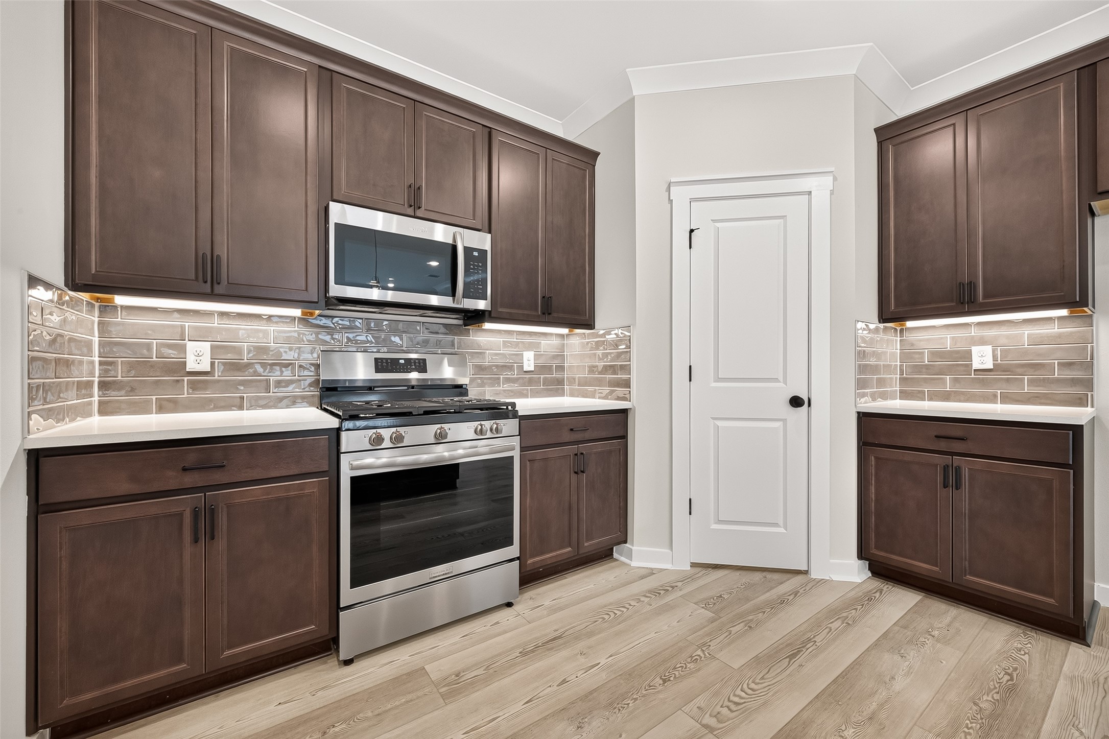 21122 Autumn Heights Rosharon, TX 77583 - Photo 15 of 42 a kitchen with granite countertop wooden cabinets and stainless steel appliances