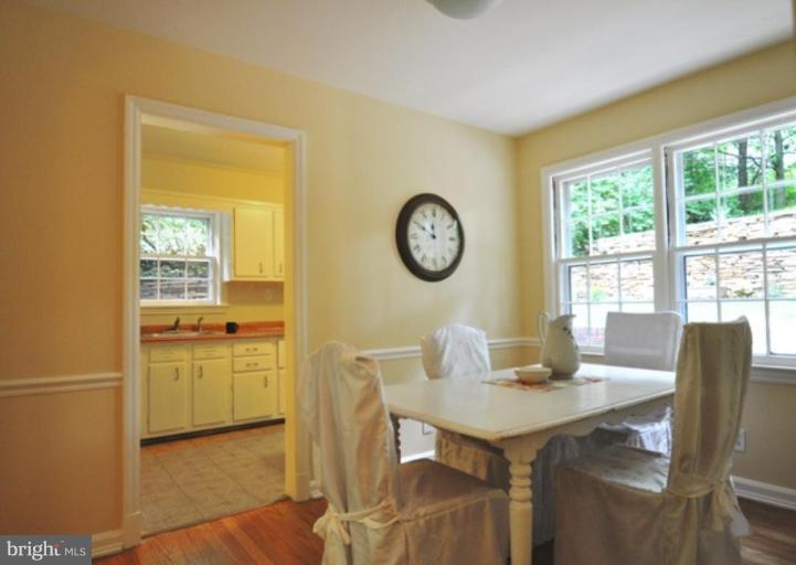 104 Parkside Road Silver Spring, MD 20910 - Photo 12 of 13 a view of a dining room with furniture window and wooden floor