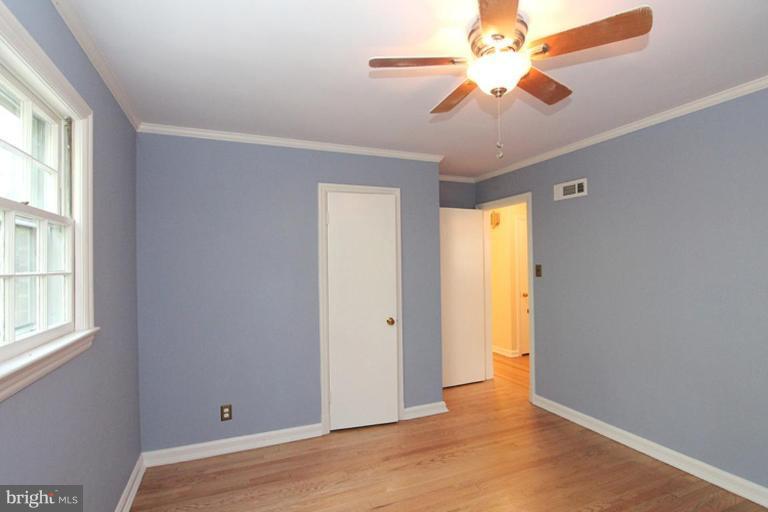 104 Parkside Road Silver Spring, MD 20910 - Photo 6 of 13 wooden floor in an empty room with a window