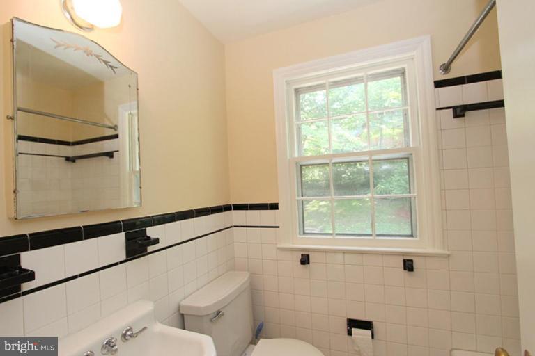 104 Parkside Road Silver Spring, MD 20910 - Photo 9 of 13 a bathroom with a toilet sink and window