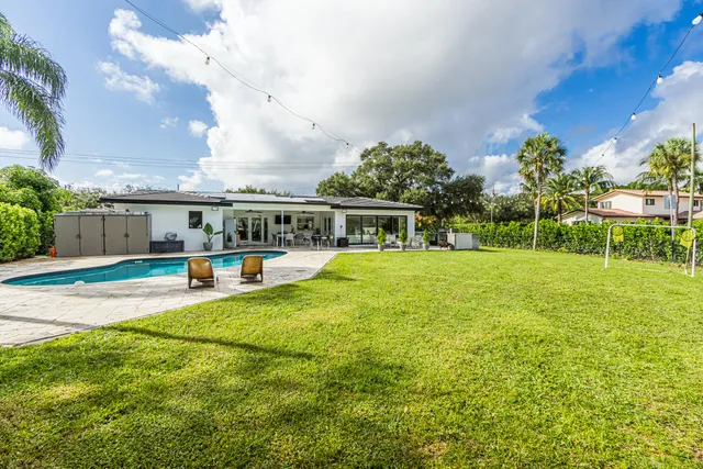 a view of a swimming pool with a lounge chair