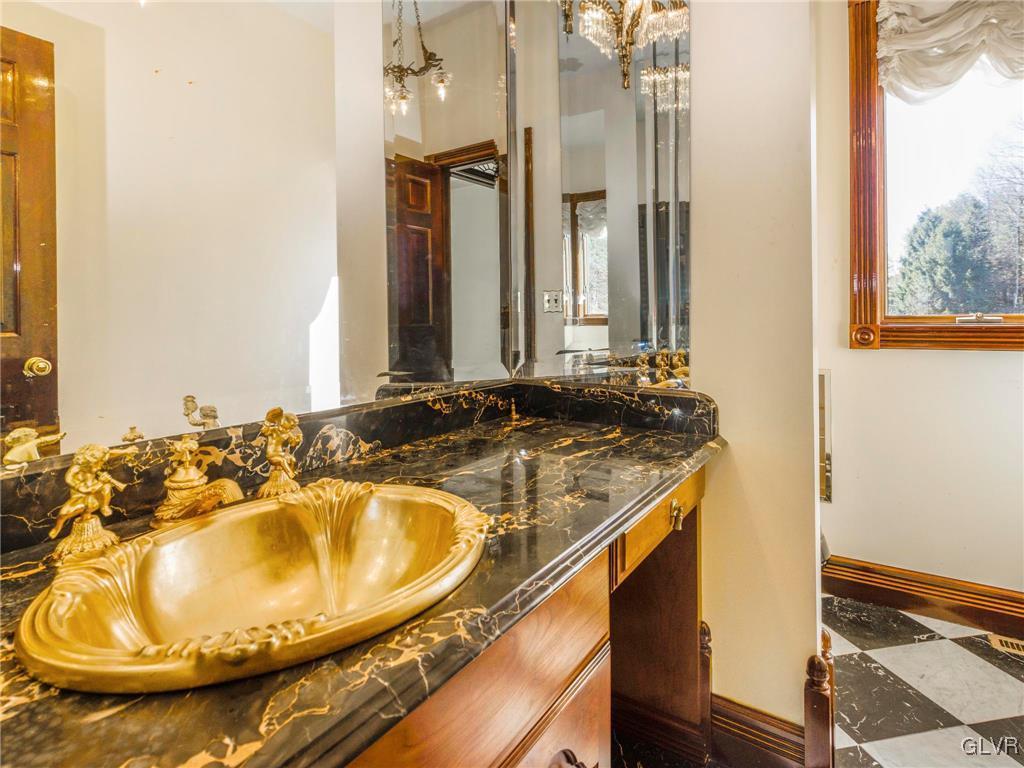 199 Evergreen Hollow Road Effort, PA 18330 - Photo 33 of 50 a bathroom with a sink and a mirror